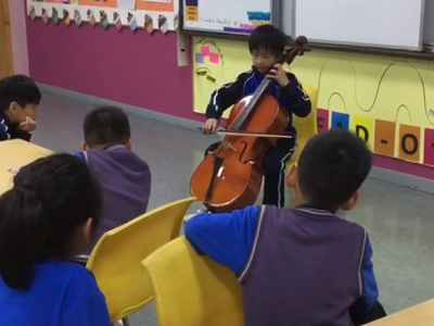 Playing cello for my classmates during recess
